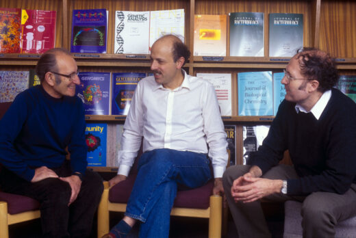 César Milstein, Michael Neuberger and Greg Winter, in the LMB Library