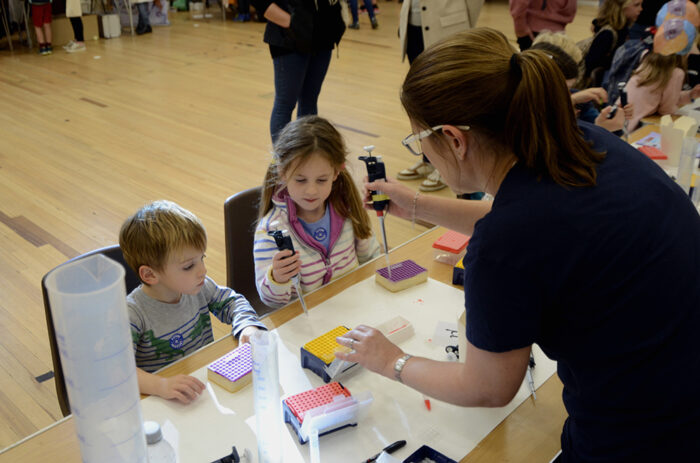 Boy and girl taking part in the pipetting activity