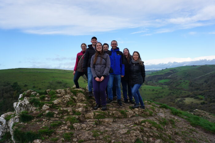 Patrycja Kozik stands with 6 of her group, at the peak of a hill