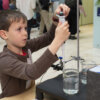 Boy pipetting