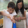 Mother and son at Cellular Machines in 3D